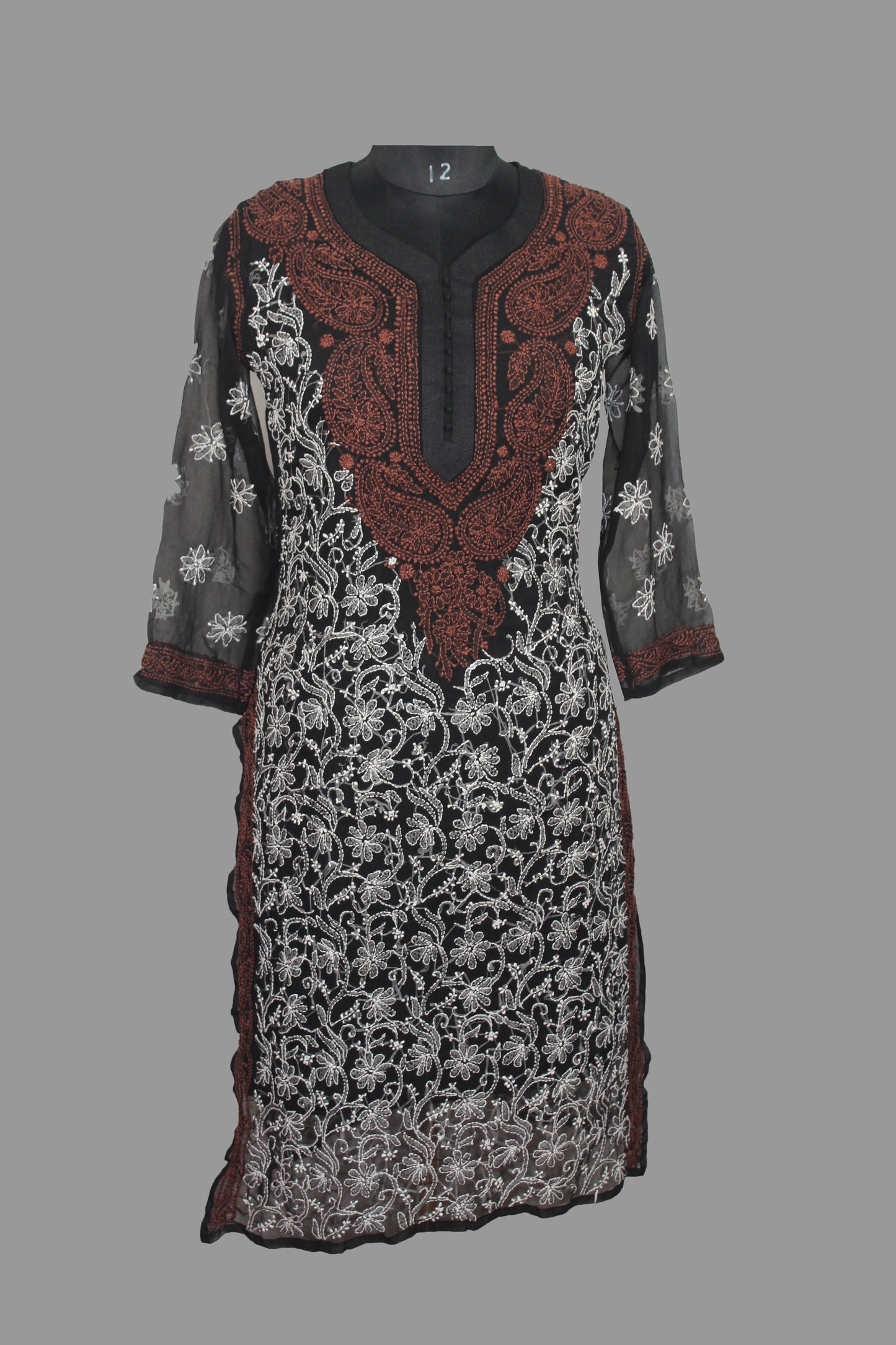Decorative dress with intricate patterns on a gray background