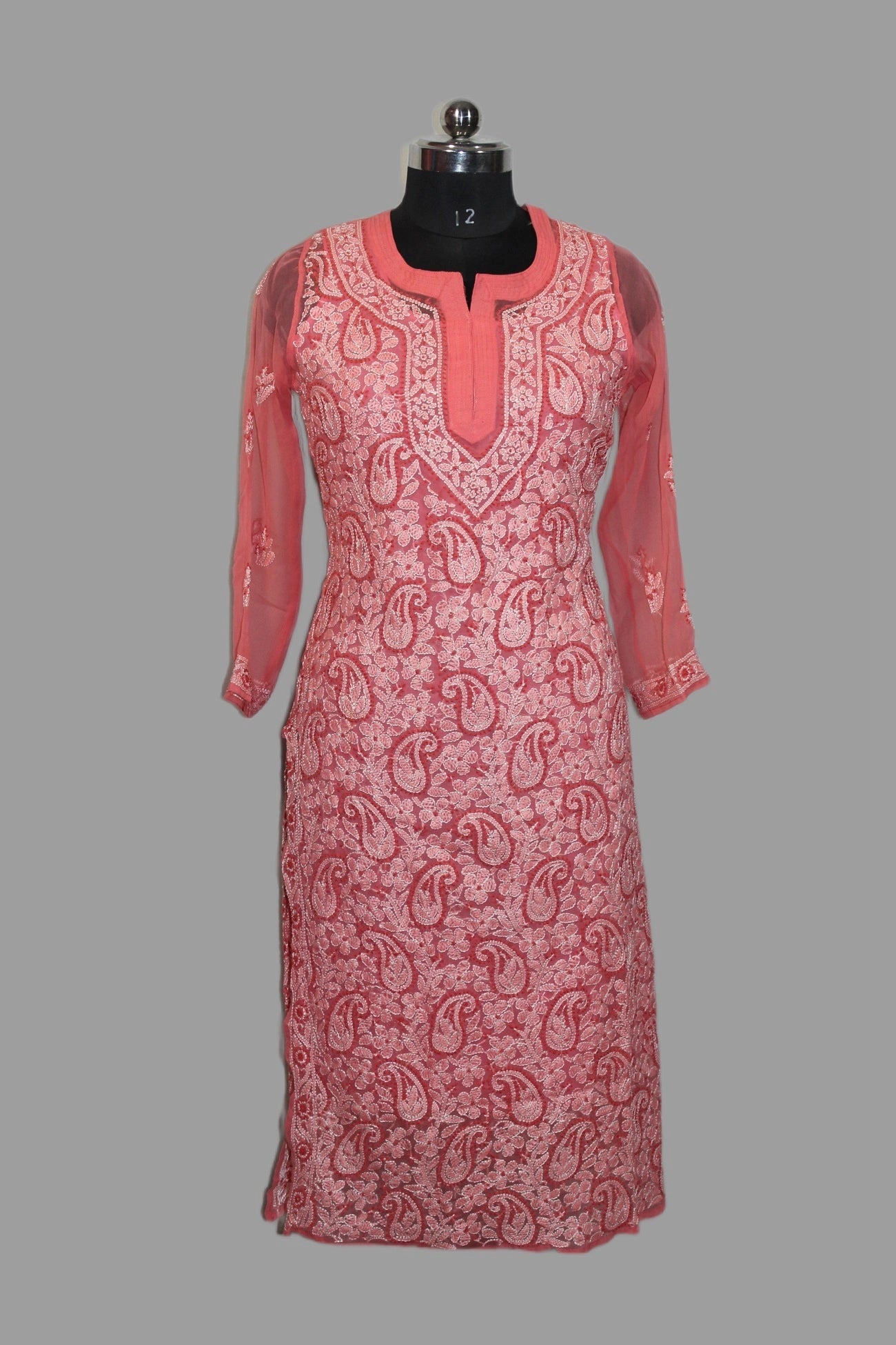 lucklnowi chikankari Red patterned dress on a mannequin against a gray background
