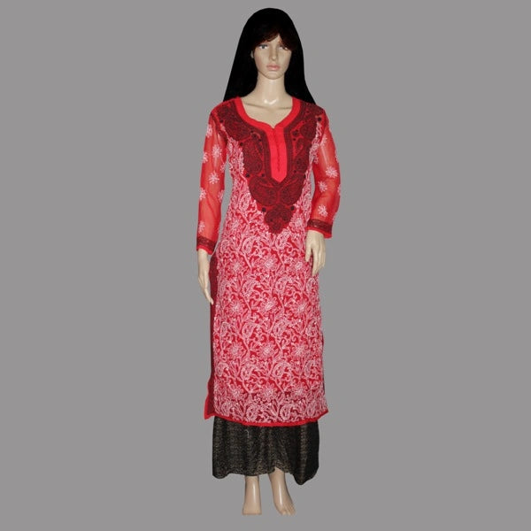 Red and black embroidered dress on a mannequin against a gray background