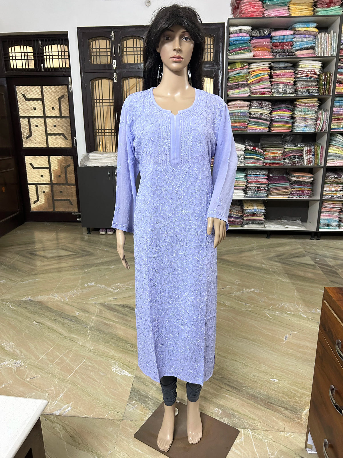 Woman wearing a lucknowi chikankari purple-colored kurta