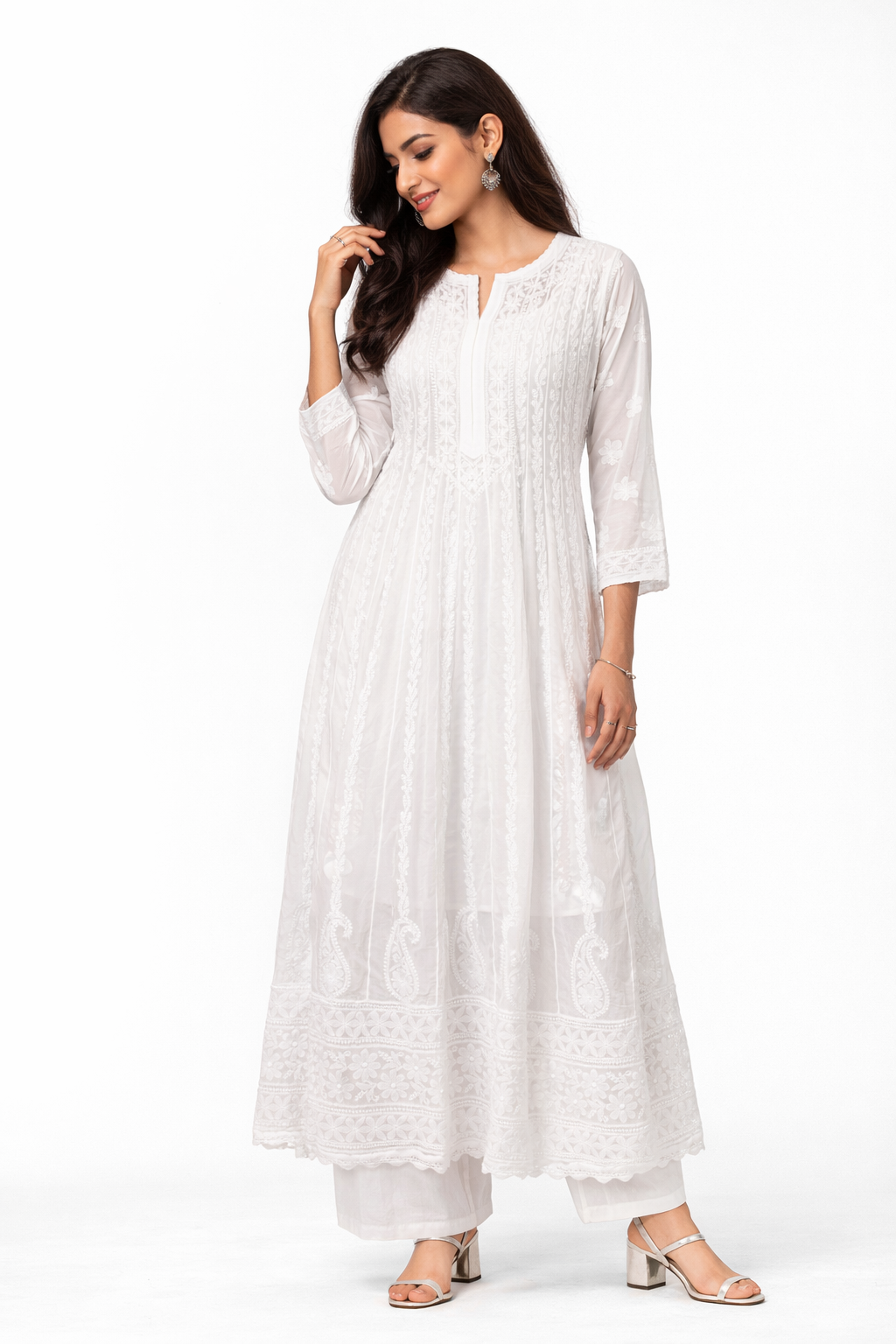 Woman wearing a white kurta with white pants on a white background