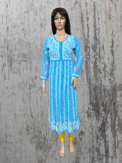 Mannequin wearing a blue embroidered dress on a textured gray background