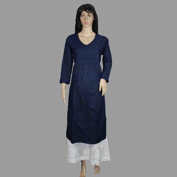 Navy blue dress with white lace hem on a mannequin against a gray background