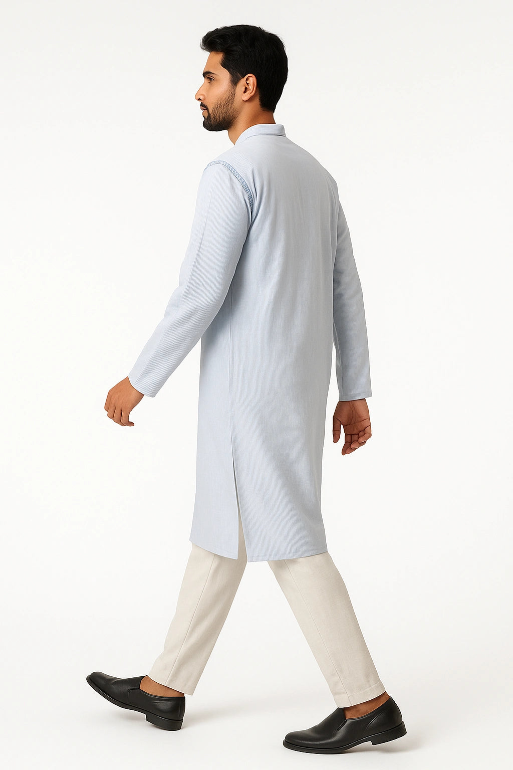 Man wearing a lucknowi chikankari light blue kurta with white pants on a white background