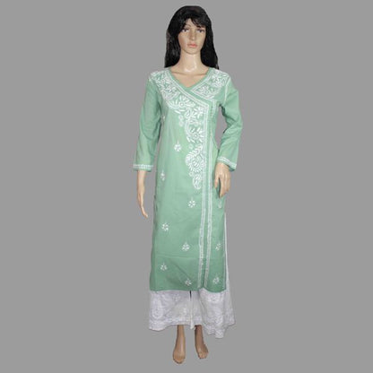 Green embroidered kurta with white pants on a mannequin against a gray background
