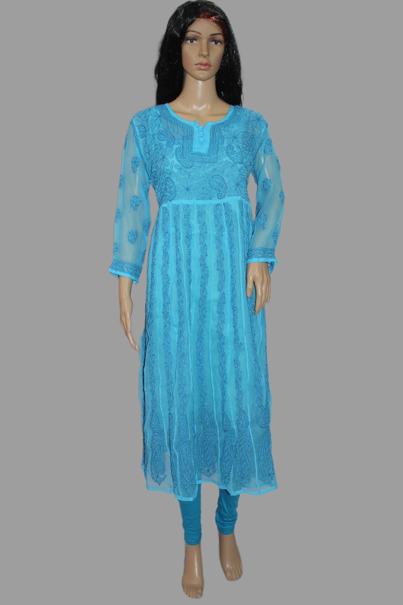 Blue hand embroidered anarkali kurta on a mannequin against a wooden background