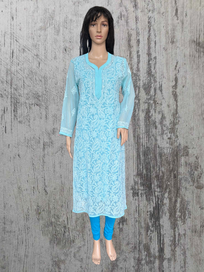 A blue embroidered kurta displayed on a female mannequin, paired with blue leggings wooden background.