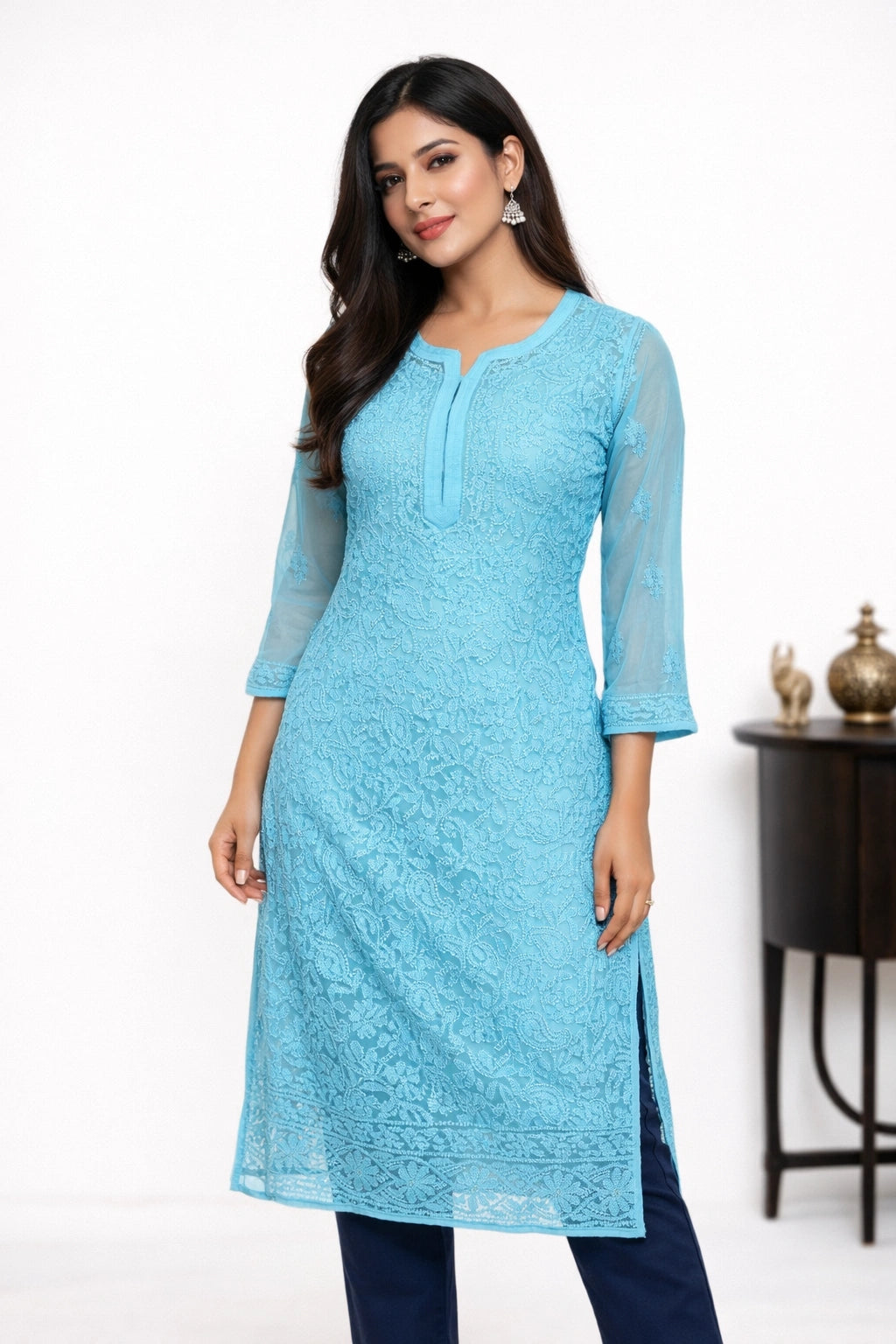 Woman wearing a light blue kurta with a white background