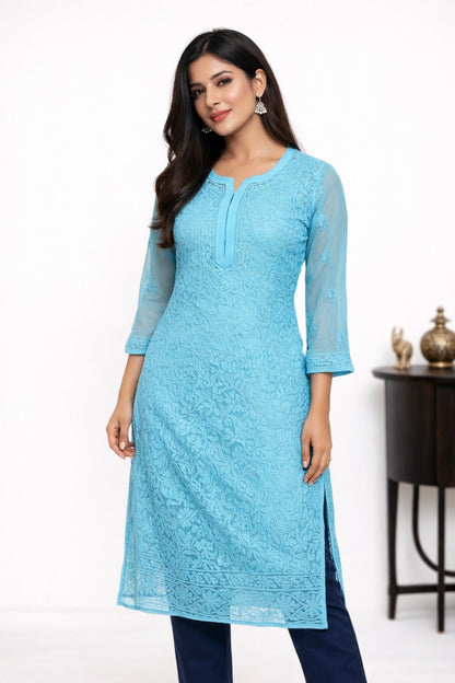 Woman wearing a light blue kurta with a white background