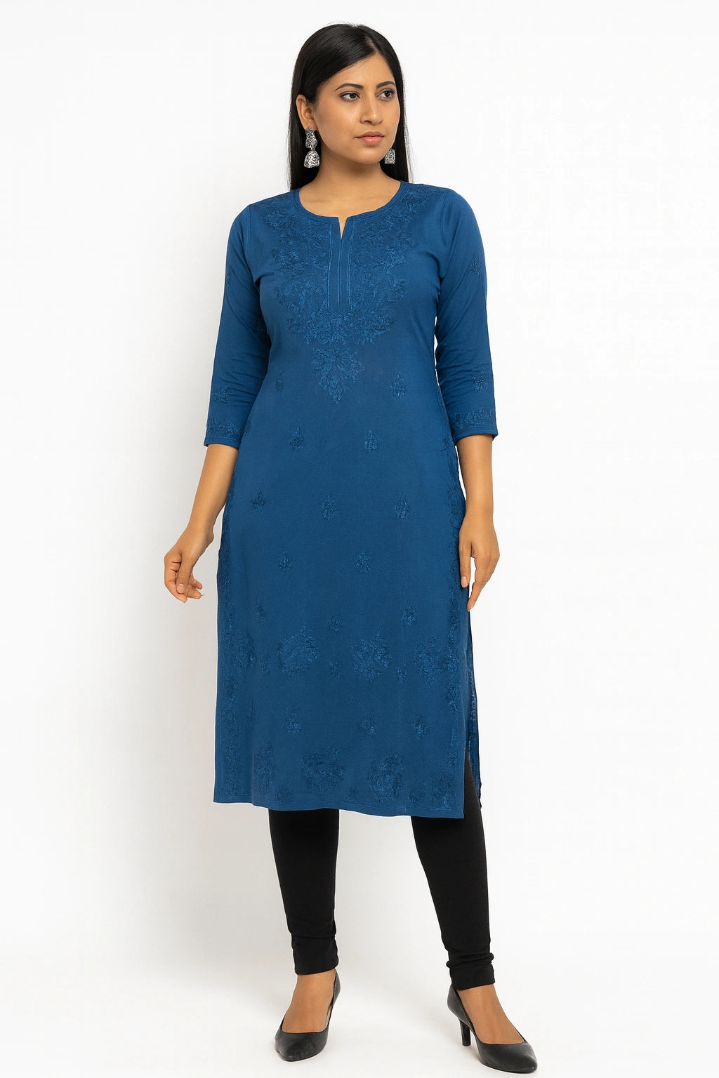Woman wearing a lucknowi chikankari blue kurta with black leggings on a white background