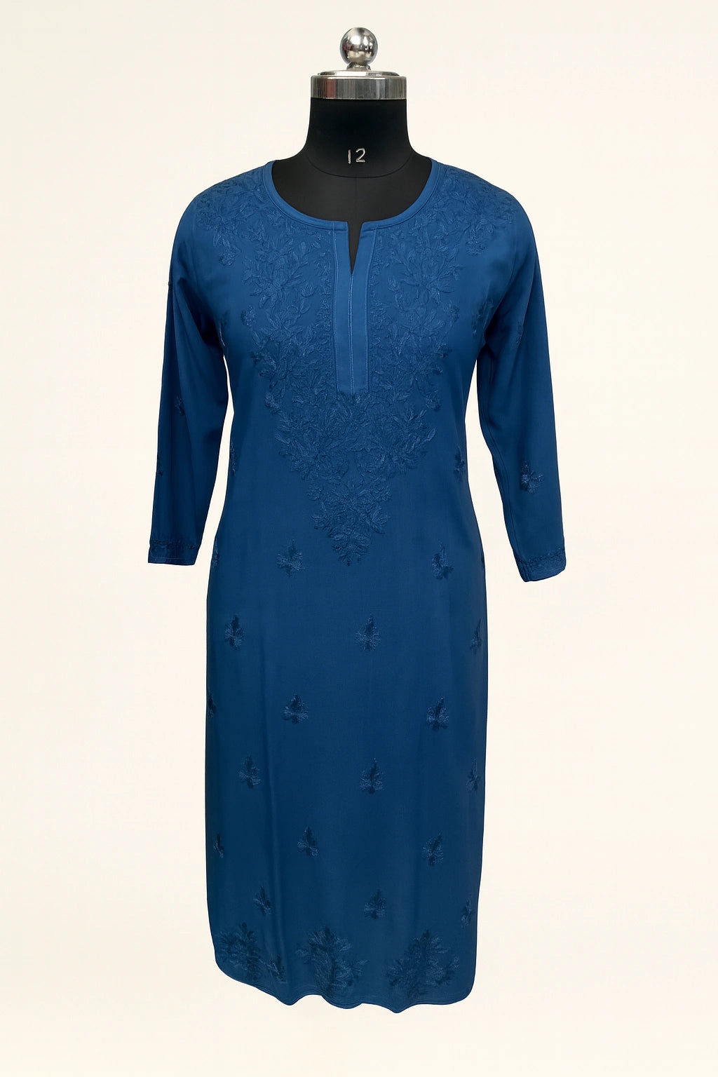 lucknowi chikankari Blue dress on a mannequin against a white background