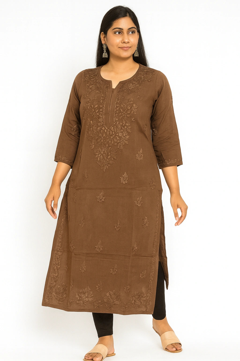 Woman wearing a brown embroidered kurta on a white background