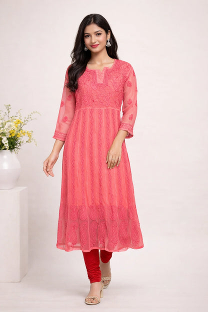 Woman wearing a lucknowi chikankari pink kurta with red pants on a white background