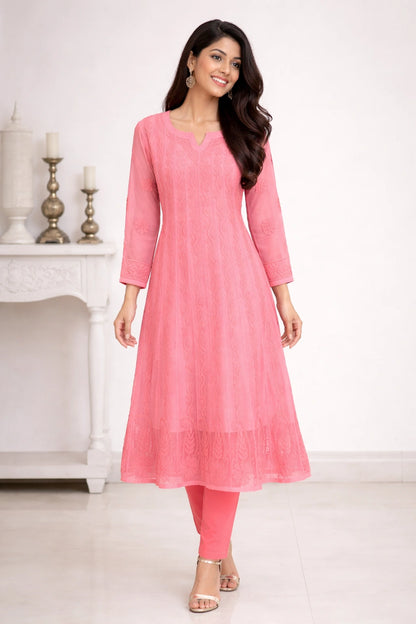 Woman wearing a pink kurta with a white background