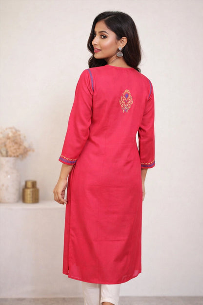 Woman wearing a pink kurta with white background
