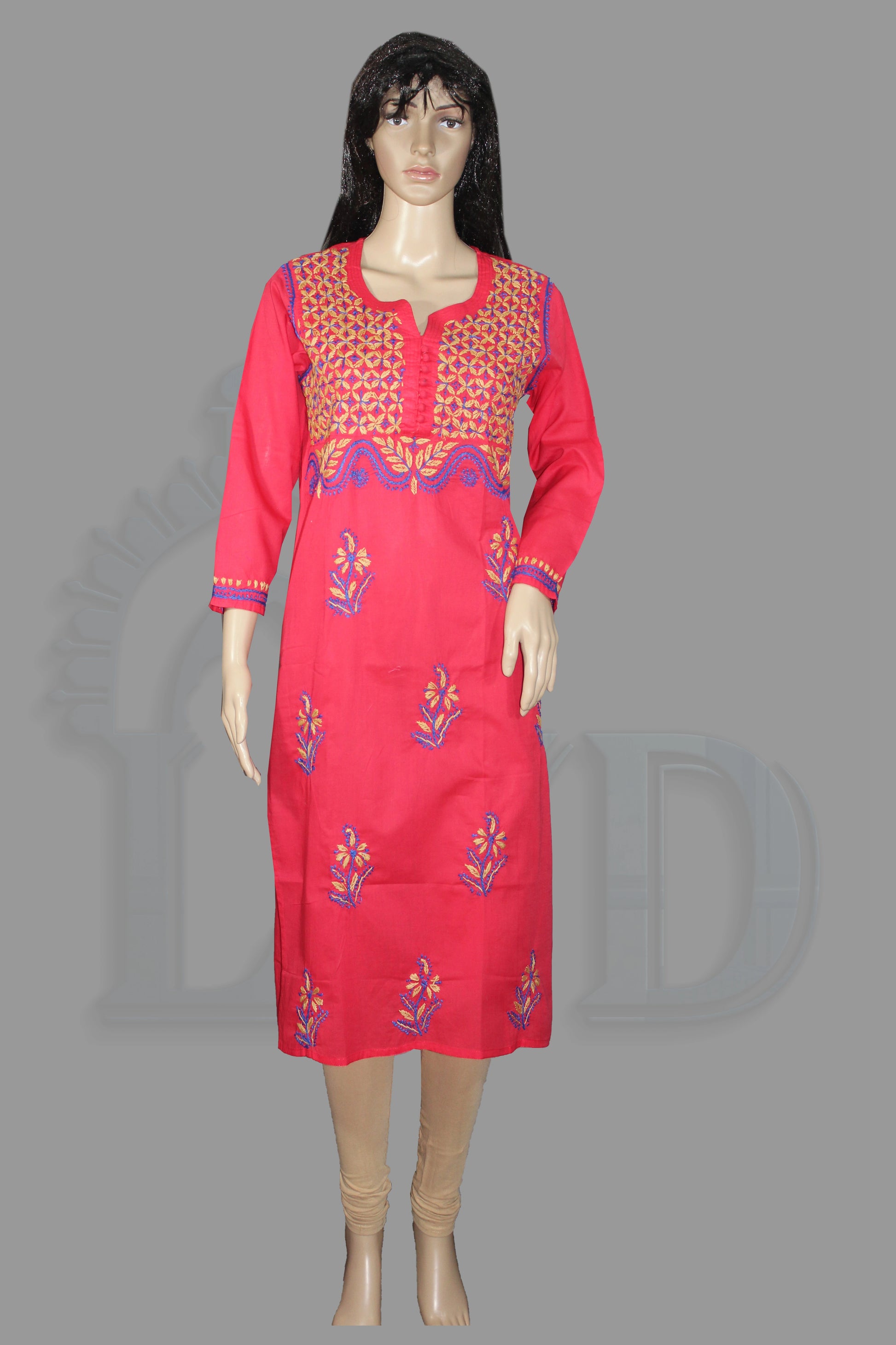 Red embroidered dress on a mannequin against a gray background
