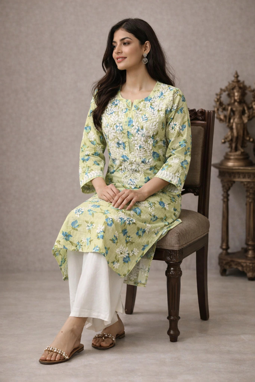 Woman wearing a chikan embroidery light gray dress with a white background