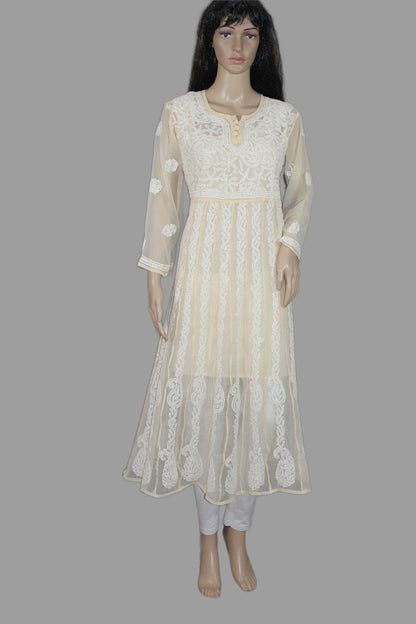 Mannequin wearing a cream-colored embroidered dress on a gray background