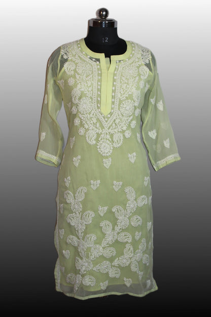Light green kurta with white embroidery on a mannequin against a gray background