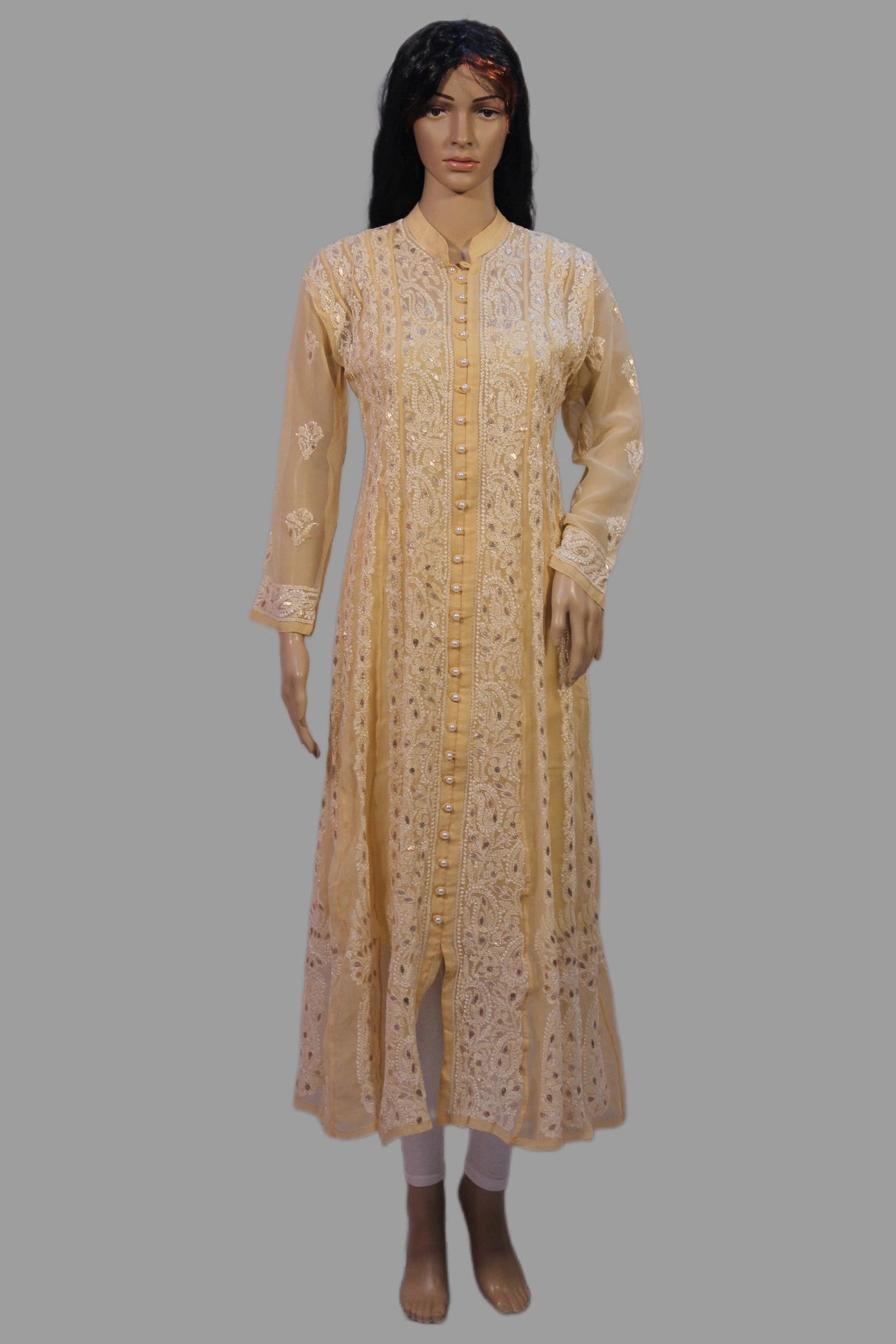 lucknowi chikankari Long beige dress with floral patterns on a gray background