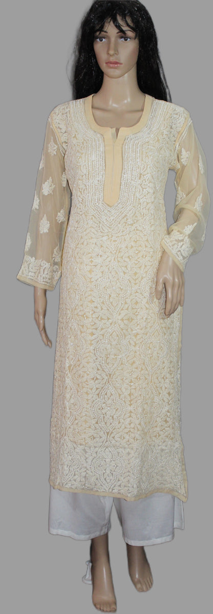 Beige lucknowi chikankari kurta with white pants on a mannequin against a gray background