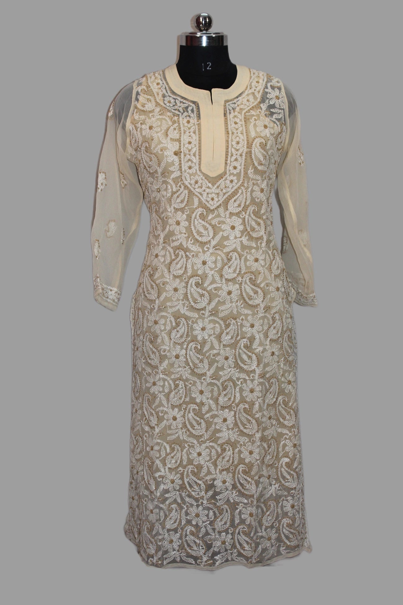 Elegant dress with intricate patterns on a gray background
