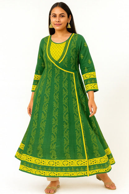 Woman wearing a lucknowi chikankari green and yellow traditional dress on a white background