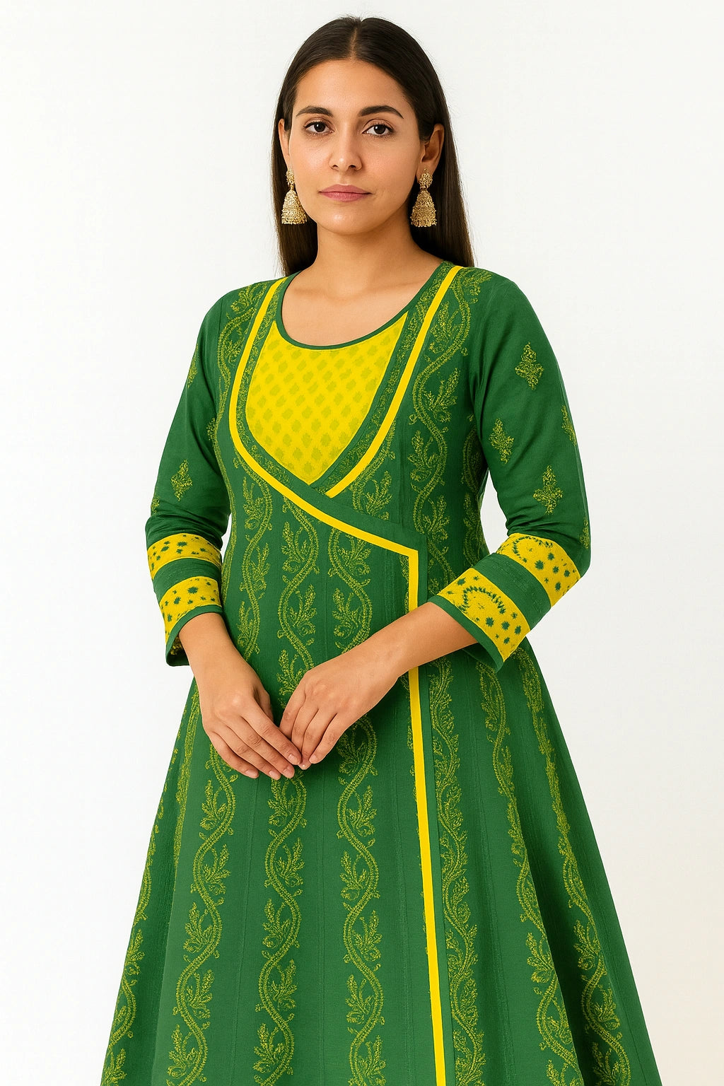 Woman wearing a lucknowi chikankari green and yellow dress with intricate patterns on a white background