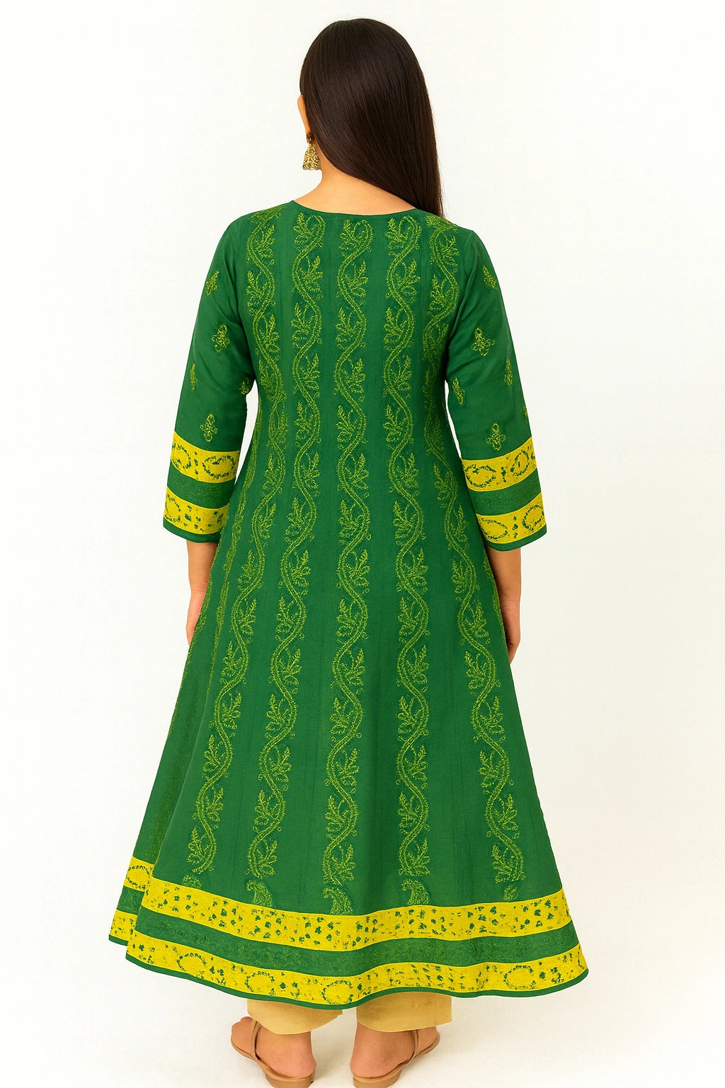 lucknowi chikankari Green and yellow traditional outfit with intricate patterns on a white background