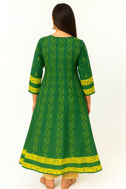 lucknowi chikankari Green and yellow traditional outfit with intricate patterns on a white background