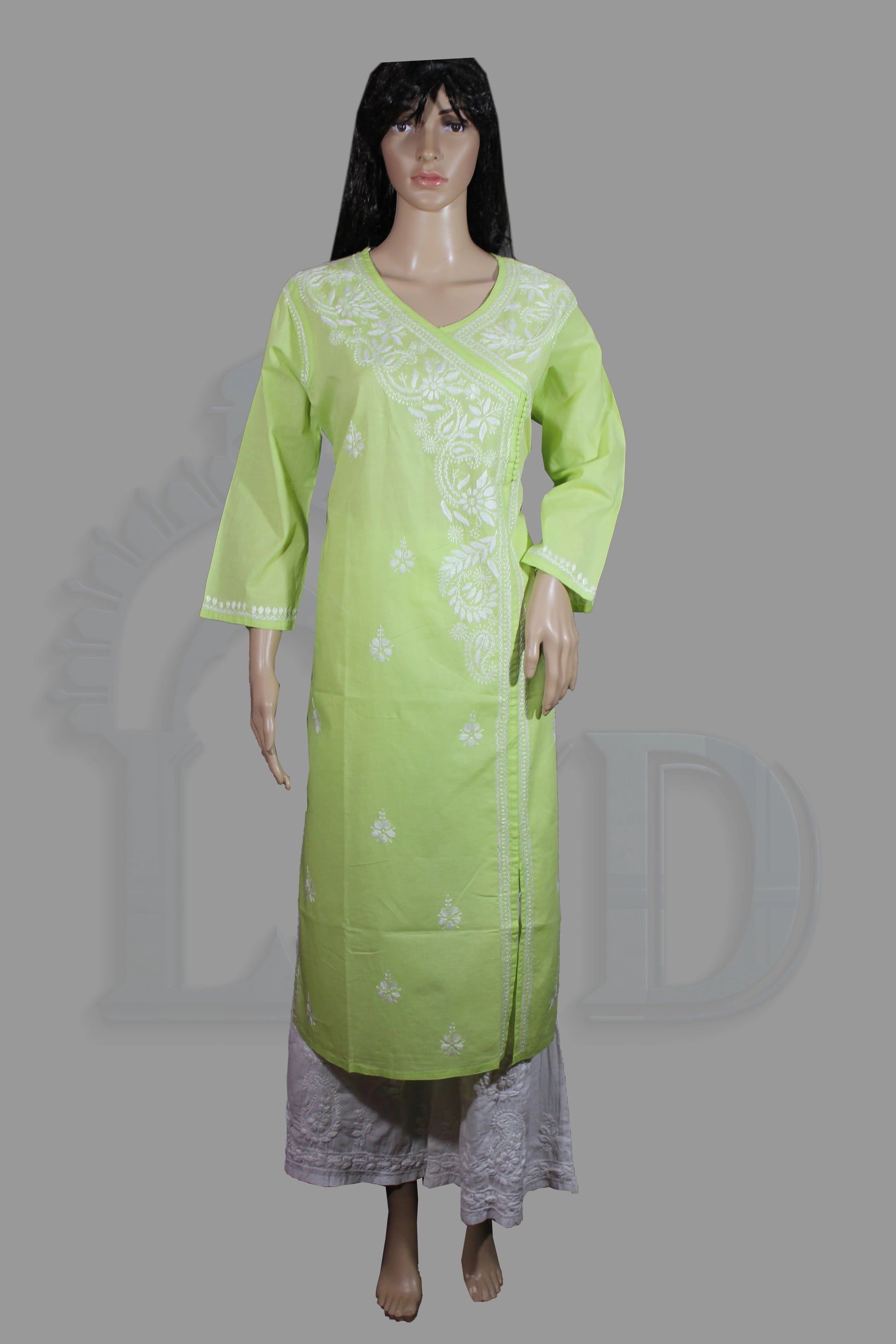 Light green kurta with white embroidery on a mannequin against a gray background