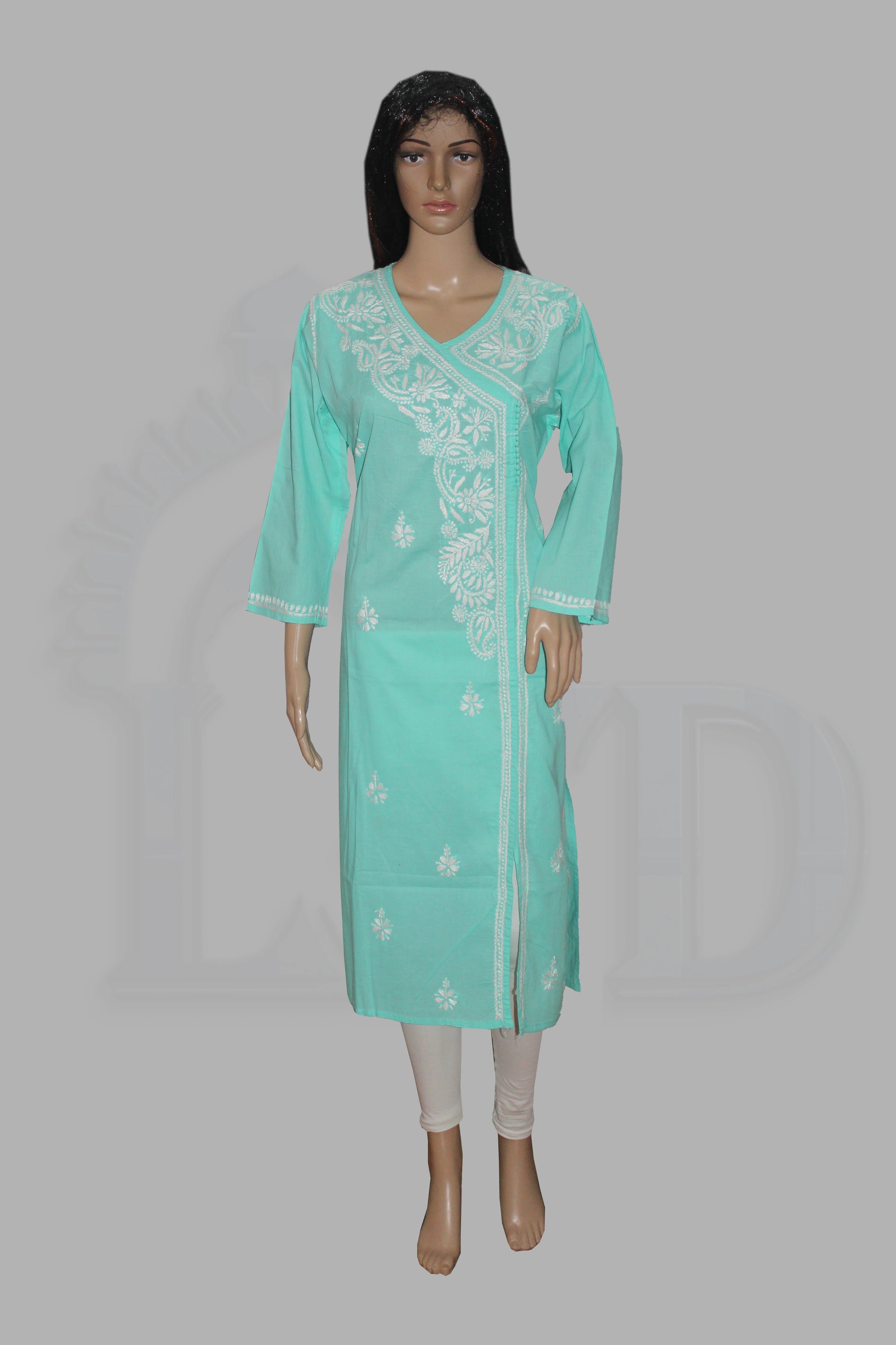 A mint green kurta with white floral embroidery on the front panel and cuffs, modeled on a mannequin against a solid gray background.