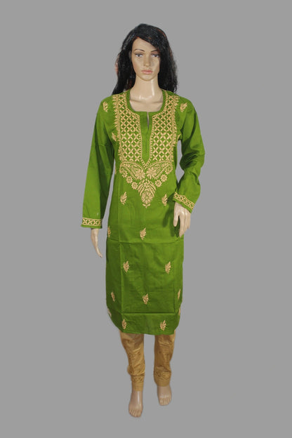 Green embroidered dress on a mannequin against a gray background
