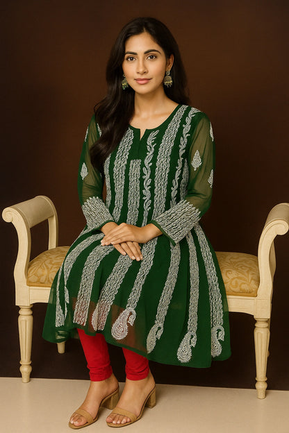 Woman wearing a green embroidered kurta with white patterns on a beige background