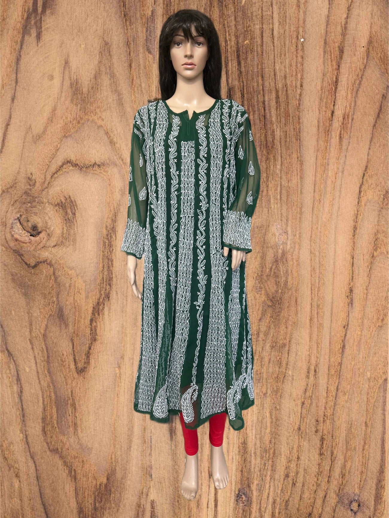 Green kurta with white floral embroidery on a beige background