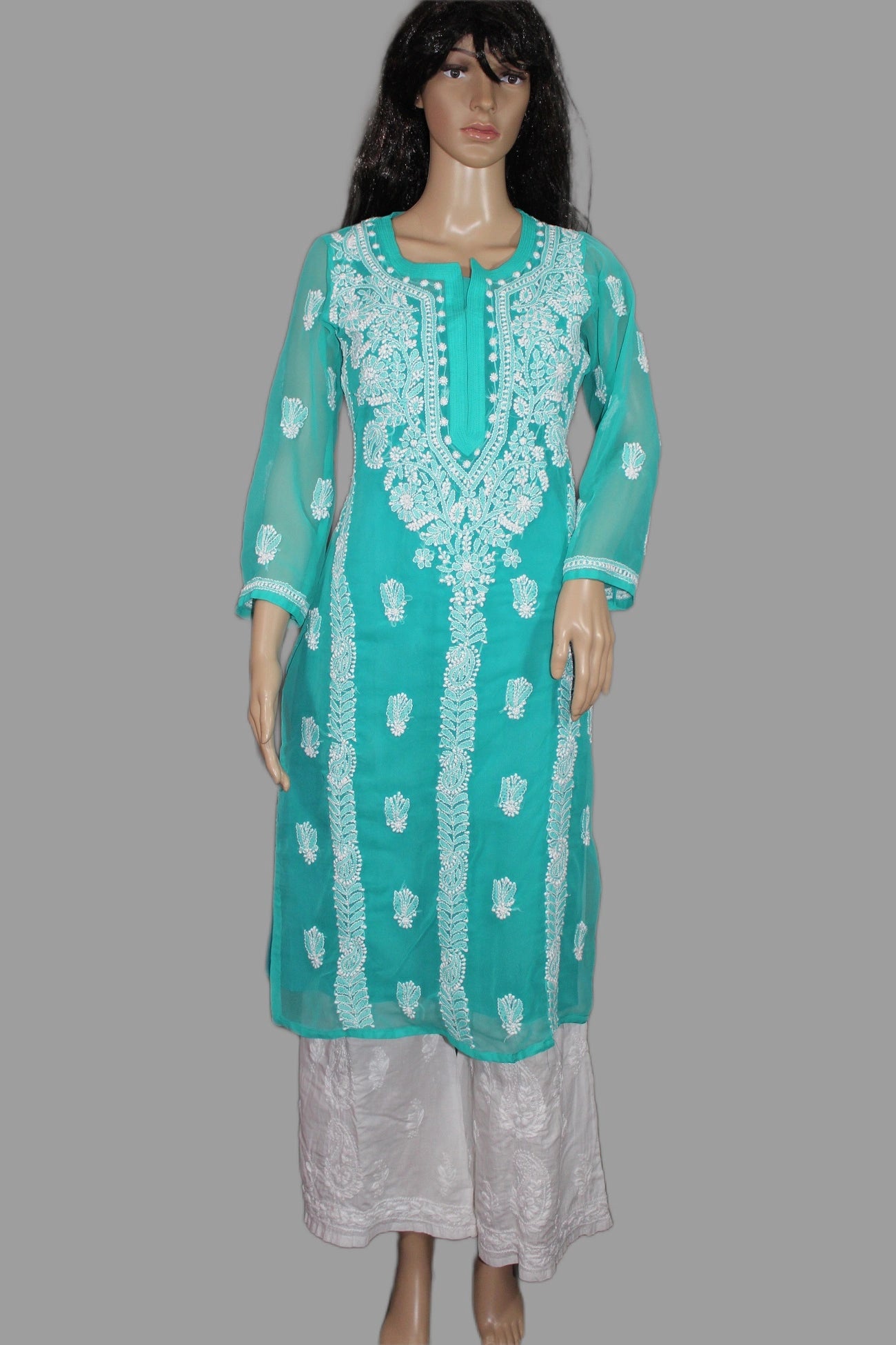 Teal embroidered kurta with white patterns on a gray background