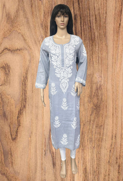A woman wearing a light gray long-sleeve kurta with white floral embroidery and a buttoned neckline, posed against a solid dark gray background.