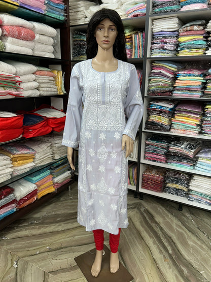 An grey long kurta with white floral embroidery displayed on a mannequin in a clothing store. The kurta features a round neckline, three-quarter sleeves, and white embroidered patterns on the front and cuffs.