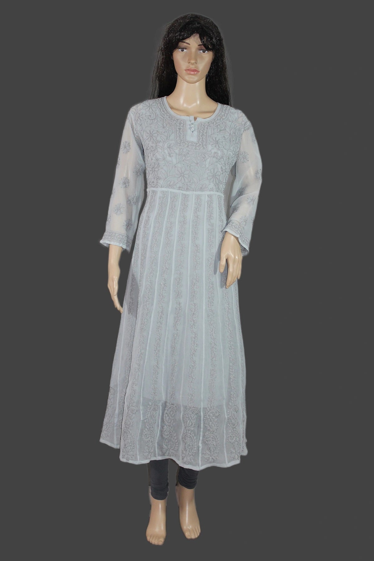 Mannequin wearing a chikan light gray dress with sheer sleeves on a dark background