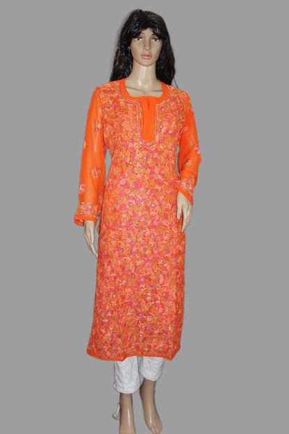 Orange patterned kurta on a mannequin against a gray background