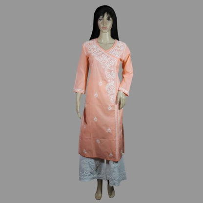 Peach-colored kurta with white embroidery on a gray background
