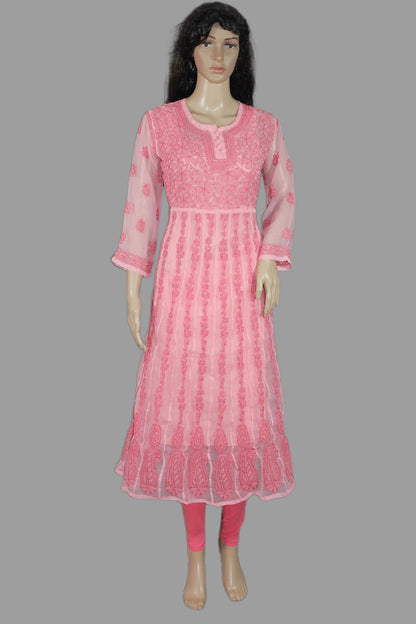 Mannequin wearing a pink embroidered dress on a gray background