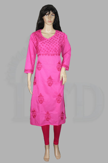 Mannequin wearing a lucknowi chikankari bright pink traditional outfit with intricate designs on a gray background