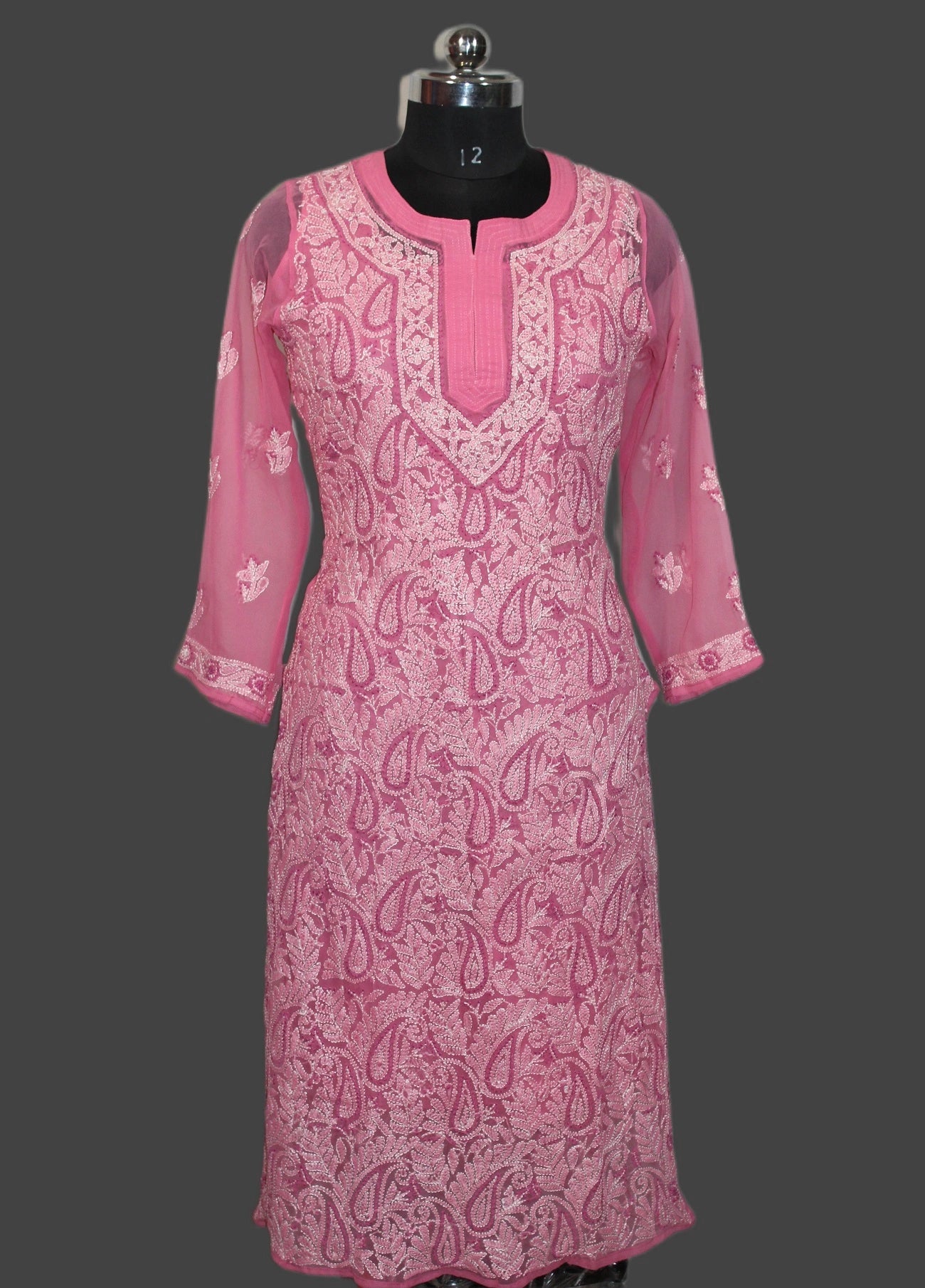 Pink lucknowi chikankari patterned kurta on a mannequin against a gray background