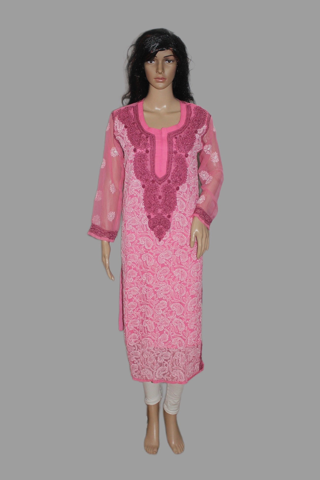 Mannequin wearing a pink embroidered kurta with white pants on a gray background