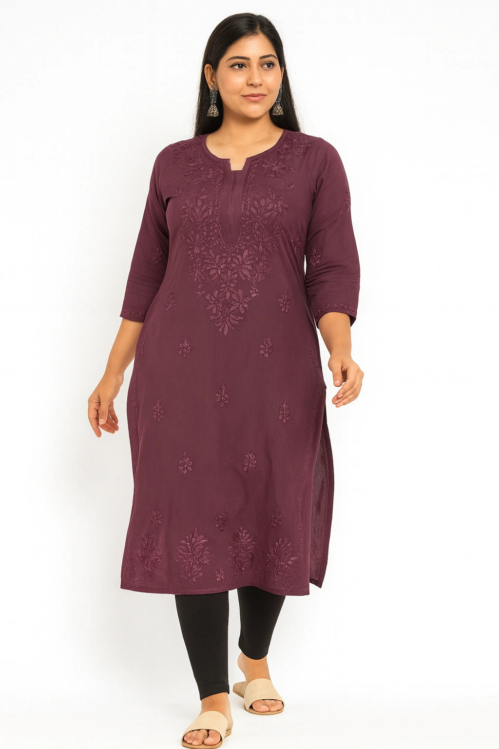 Woman wearing a purple embroidered kurta on a white background