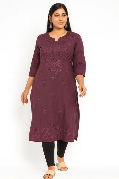 Woman wearing a purple embroidered kurta on a white background
