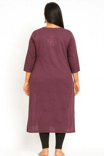 Woman wearing a lucknowi chikankari maroon kurta with a snowflake design on a white background