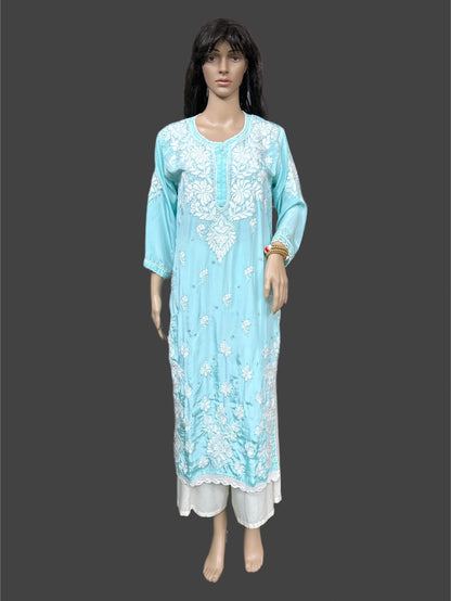 Light blue embroidered dress on a mannequin against a dark background