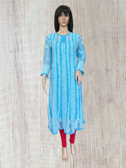 lucknowi chikankari Mannequin wearing a light blue dress in a fabric store with shelves of colorful fabrics.